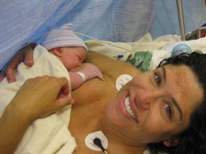 baby and mom in the operating room right after delivery